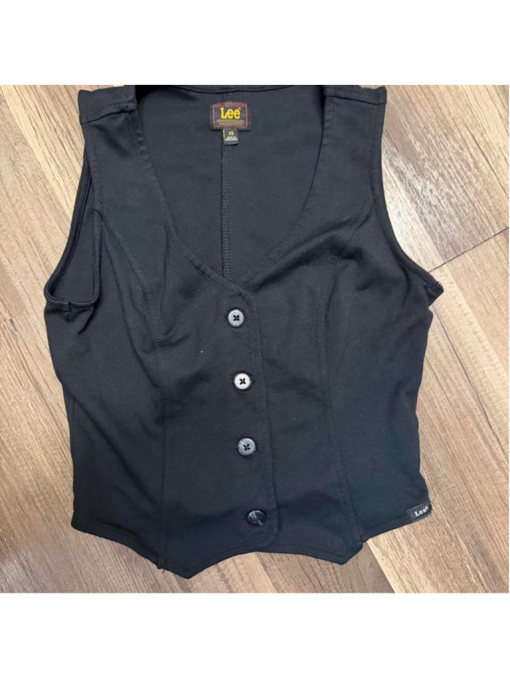 Lee black fitted vest top with a corset-inspired silhouette, deep V neckline, bu